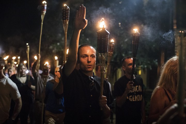 Torch-bearing white nationalists rally around a statue of Thomas Jefferson on the University of Virginia campus in Charlottesville.